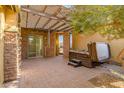 Covered patio with hot tub and pergola at 17730 W Redwood Ln, Goodyear, AZ 85338