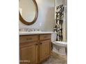 Bathroom with wood cabinets and tile flooring at 18546 E Oak Hill Ln, Queen Creek, AZ 85142