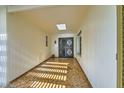 Inviting entryway with tiled flooring and decorative door at 18852 N Aztec Dr, Sun City, AZ 85373