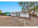 Single story home with a rock front yard and mature tree at 2087 E 10Th St, Tempe, AZ 85281