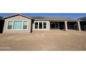 Back of house view, showcasing large windows and patio at 22665 E Stacey Rd, Queen Creek, AZ 85142