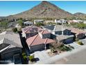 House with solar panels, located in a residential neighborhood near a mountain at 25210 N 54Th Dr, Phoenix, AZ 85083