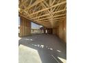 Spacious garage construction, highlighting the open layout, framing of the walls, and concrete slab at 32189 N Lone Rancher Way, San Tan Valley, AZ 85140