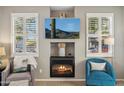 Living room fireplace with built-in shelving and TV at 4364 E Selena Dr, Phoenix, AZ 85050