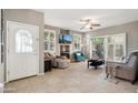 Bright living room with fireplace, comfortable seating, and tiled floors at 4364 E Selena Dr, Phoenix, AZ 85050