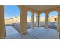 Covered entryway with arched details and iron railings at 5411 W Windmill Ln, Eloy, AZ 85131