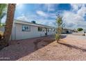 Newly renovated single story home with gray exterior, landscaping, and driveway at 5927 W Mulberry Dr, Phoenix, AZ 85033