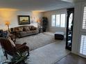 Spacious living room with ample seating and large windows at 5929 E Duncan St, Mesa, AZ 85205