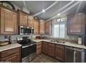 Modern kitchen featuring stainless steel appliances and ample cabinetry at 650 N Hawes Rd # 3431, Mesa, AZ 85207