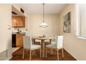 Cozy dining room featuring a round table with seating for four and natural light at 6820 S Rita --, Tempe, AZ 85283