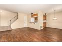 Bright living room with wood-look floors and a view of the kitchen at 6820 S Rita --, Tempe, AZ 85283