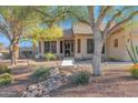 Well-maintained house with mature trees and a welcoming entrance at 6825 S Whetstone Pl, Chandler, AZ 85249