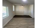 Bright and airy living room with new wood-look flooring at 7015 N 23Rd Ln, Phoenix, AZ 85021