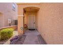 Covered entryway with a security door and small sitting area at 7019 W Mcmahon Way, Peoria, AZ 85345