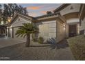 Front view of home with two-car garage and desert landscaping at 7132 W Villa Chula --, Glendale, AZ 85310