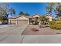 Beautiful tan house with three car garage at 7132 W Villa Chula --, Glendale, AZ 85310