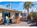 Relaxing patio with colorful chairs and fire pit at 7501 N 22Nd Pl, Phoenix, AZ 85020