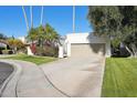 House exterior with garage, landscaping, and driveway at 8008 E Del Rubi Dr, Scottsdale, AZ 85258