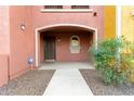 Townhome's front entrance with a small patio and landscaping at 900 S 94Th St # 1001, Chandler, AZ 85224