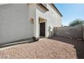 Front entrance with a dark brown door and stone accents at 9089 W Troy Dr, Arizona City, AZ 85123