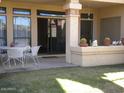 Private patio with seating area and grassy backyard at 9707 E Mountain View Rd # 1430, Scottsdale, AZ 85258