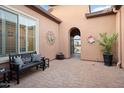 Relaxing courtyard with a bench and access to the house at 12935 W Lone Tree Trl, Peoria, AZ 85383