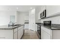 Modern kitchen with stainless steel appliances and granite countertops at 1531 E Lardner Dr, Casa Grande, AZ 85122