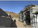 Side view of under construction home with modern design at 16025 N Ringtail Trl, Fountain Hills, AZ 85268