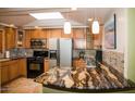 Updated kitchen with granite countertops and stainless steel appliances at 2157 W Mulberry Dr, Phoenix, AZ 85015