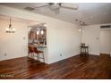 Spacious living area with hardwood floors and kitchen views at 2157 W Mulberry Dr, Phoenix, AZ 85015