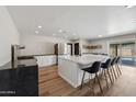 Modern kitchen with white cabinets, large island, and stainless steel appliances at 2928 E Cortez St, Phoenix, AZ 85028