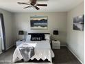 Bright bedroom with a queen-size bed and gray carpeting at 3135 W Pecan Rd, Phoenix, AZ 85041