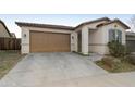 Front view of a house with a brown garage door and neutral siding at 333 N Calle Largo --, Mesa, AZ 85207