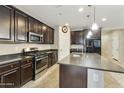 Modern kitchen featuring stainless steel appliances and a large kitchen island at 333 N Calle Largo --, Mesa, AZ 85207