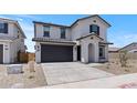 A modern two-story home featuring low maintenance landscaping, a two car garage and stylish shutters at 7416 S 76Th Ln, Laveen, AZ 85339