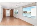 Bright dining room with wood-look floors and access to the kitchen at 747 E Germann Rd # 67, San Tan Valley, AZ 85140