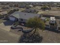 Single story home with landscaped front yard, large driveway and RV parking at 8547 W Magnum Dr, Arizona City, AZ 85123