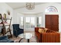 Cozy living room with seating area and large windows at 10484 E Mission Ln, Scottsdale, AZ 85258