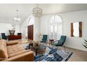 Bright living room with comfortable seating and large windows at 10484 E Mission Ln, Scottsdale, AZ 85258