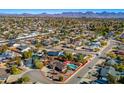 Aerial view showing a single-story house with a pool and surrounding neighborhood at 13601 N 50Th Pl, Scottsdale, AZ 85254