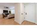 Bright entryway with white door and wood flooring at 1722 Leisure World --, Mesa, AZ 85206