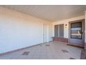 Covered patio with tile flooring and exterior door at 1722 Leisure World --, Mesa, AZ 85206