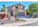 Two-story house with gray garage door and desert landscaping at 20219 N 33Rd Pl, Phoenix, AZ 85050