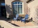 Relaxing patio with two Adirondack chairs, providing a peaceful outdoor space at 20546 N 83Rd Pl, Scottsdale, AZ 85255