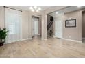 Light and airy dining room with wood-look floors and access to the kitchen at 2114 W Red Fox Rd, Phoenix, AZ 85085