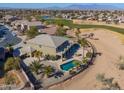 Two-story home with a pool and a golf course view at 22155 N Cline Ct, Maricopa, AZ 85138