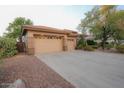 Two-car garage with a large driveway, offering ample parking space at 2740 S Honeysuckle Ln, Gilbert, AZ 85295