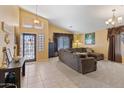 Spacious living room featuring a large sectional sofa and neutral decor at 2910 E Quiet Hollow Ln, Phoenix, AZ 85024