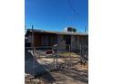 House exterior requiring renovation, with a chain link fence at 299 N Fresno St, Chandler, AZ 85225