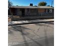 A fixer-upper home with a chain link fence and needs some repairs at 299 N Fresno St, Chandler, AZ 85225